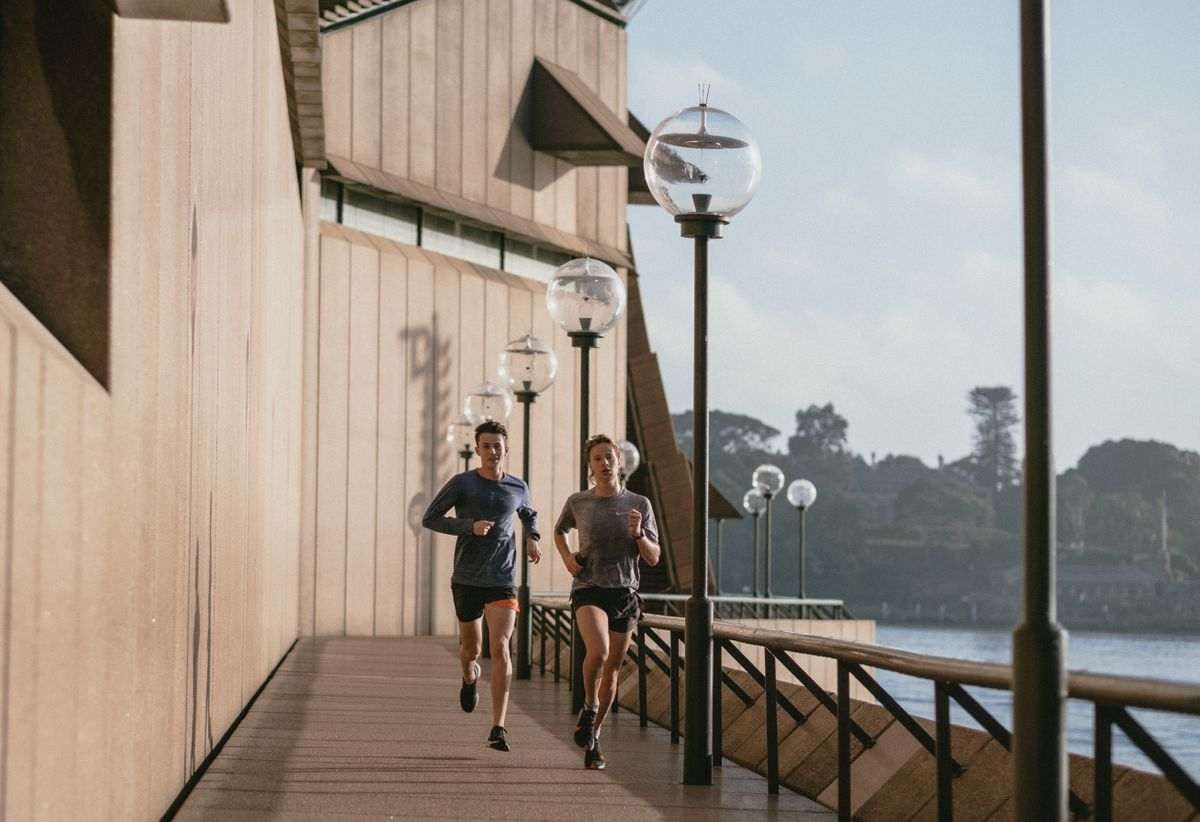 A weight loss personal trainer running with a client