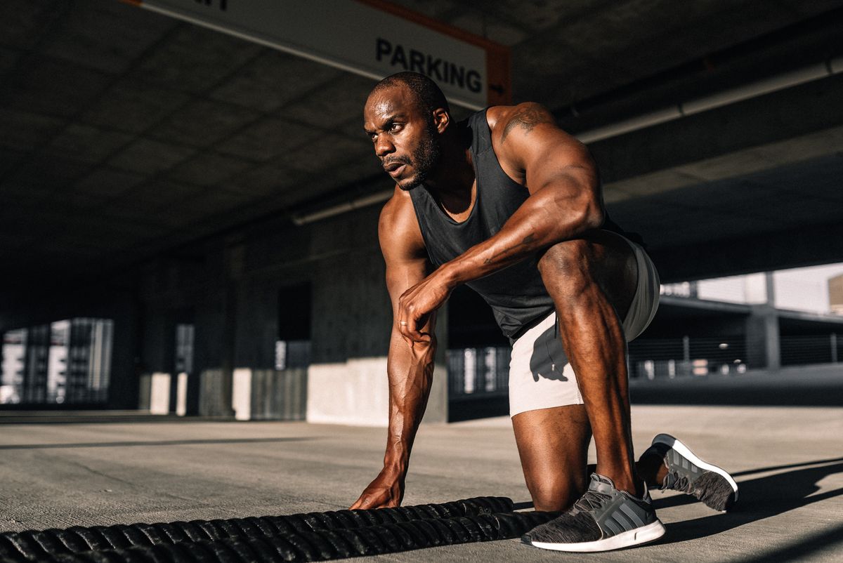 Personal trainer completing a total body HIIT workout.