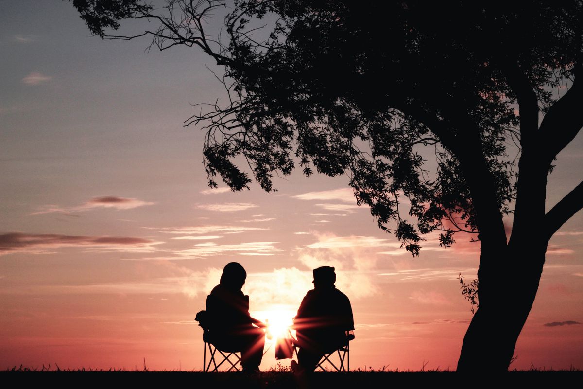 An elderly couple exercising.