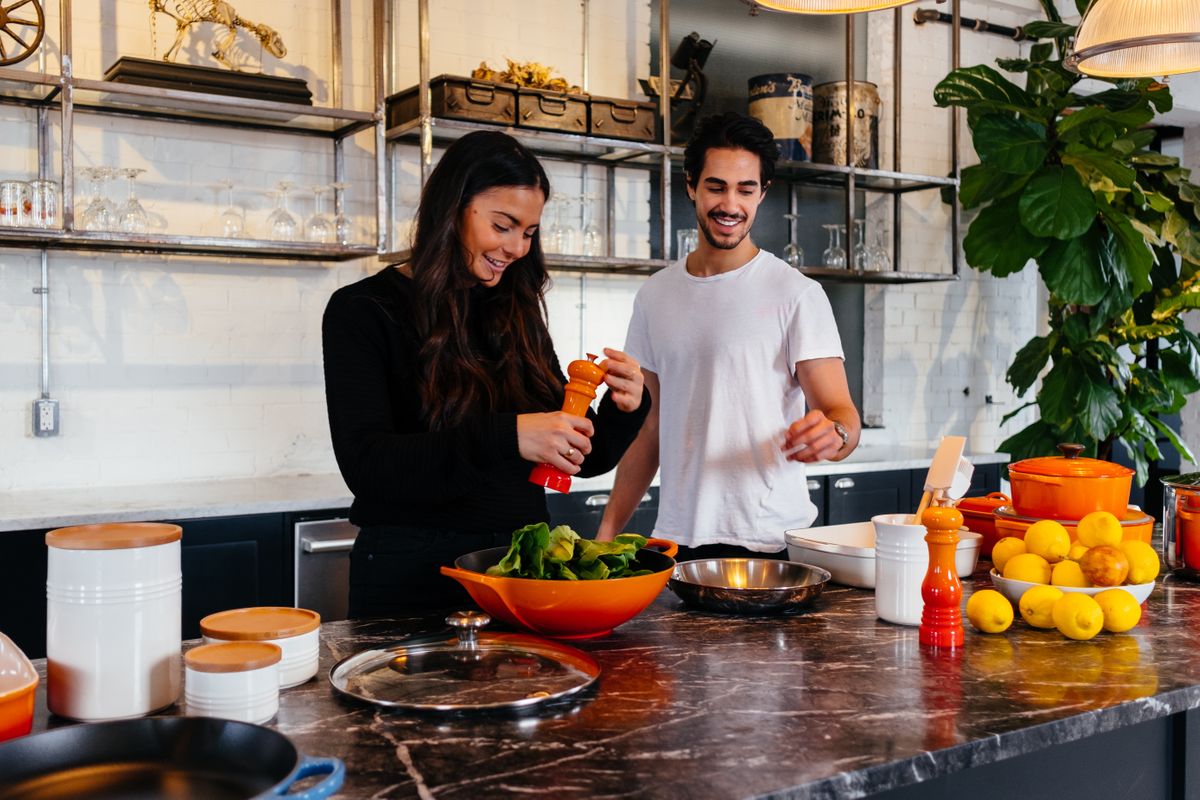 Personal trainers preparing healthy food