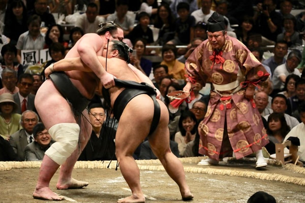 Sumo wrestlers demonstrating their fitness