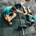 Two people discussing why to get a personal trainer.