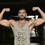 A man flexing his bicepts