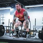 A man benefitting from strongman supplements. 