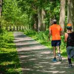 Personal trainers for seniors taking a run. 