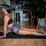 A woman using an at-home gym. 
