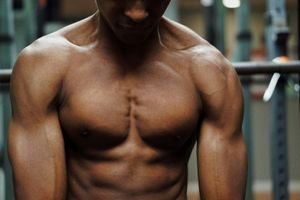 A man cutting (i.e., shedding fat)