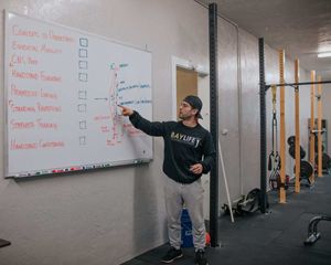 A man explaining personal trainer accreditation. 