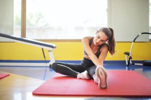 Pilates personal trainer stretching