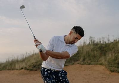 A man playing golf