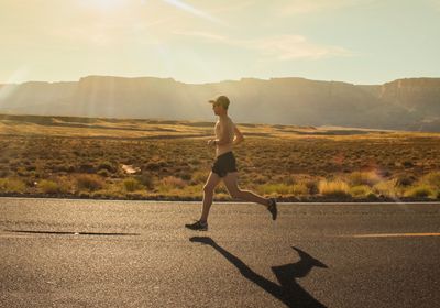 A man enjoying the benefits of strength training for runners.