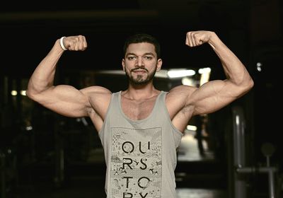 A man flexing his bicepts