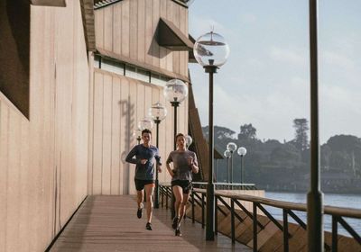 A weight loss personal trainer running with a client