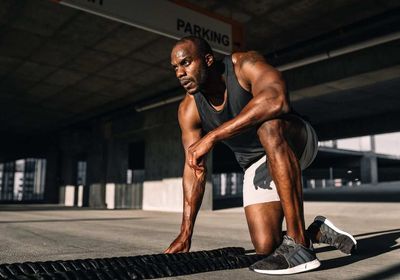 Personal trainer completing a total body HIIT workout. 