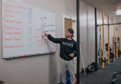 A man explaining personal trainer accreditation. 