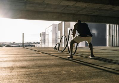 Man working out with a rope