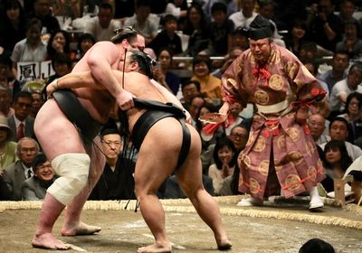 Sumo wrestlers demonstrating their fitness