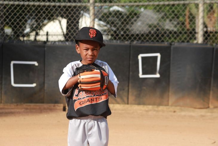 A boy starting sports young.