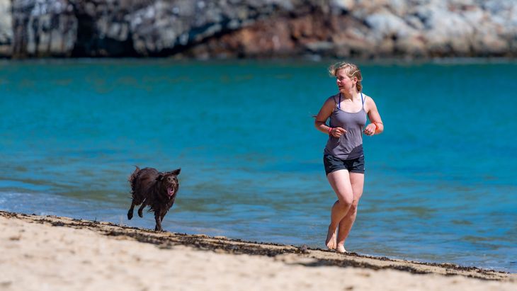 A woman jogging on the beach