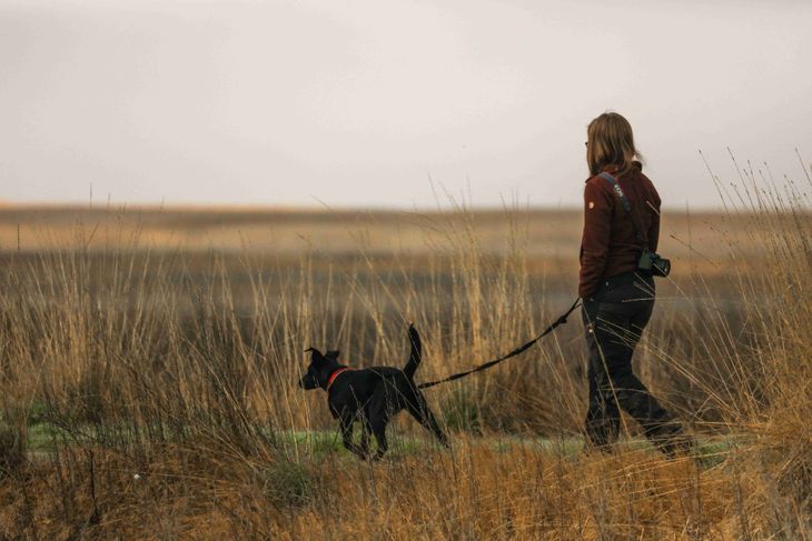 A man with a dog practising self-care.