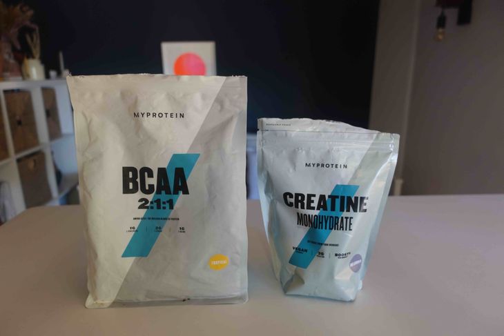 A bag of BCAAs and a bag of creatine