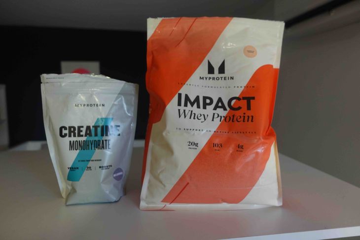 A bag of creatine and a bag of whey protein