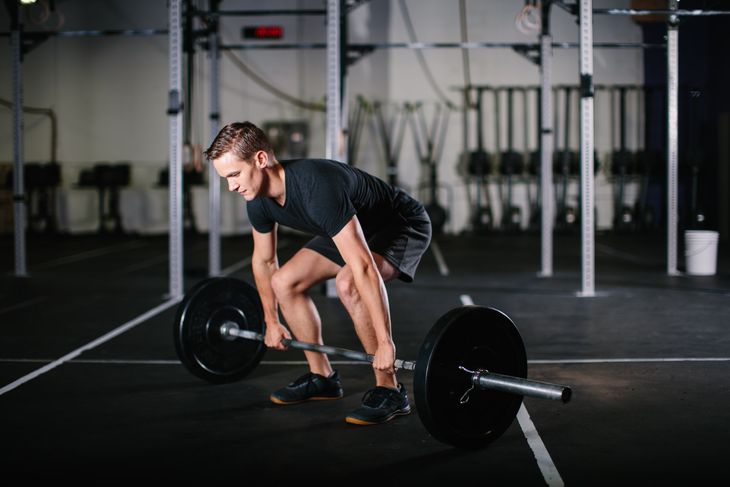 Man lifting weights. 