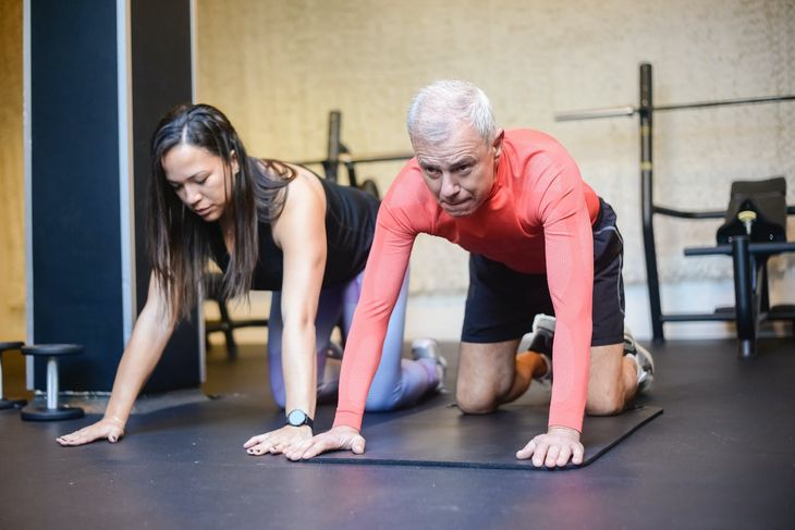 A personal trainer with an aging client