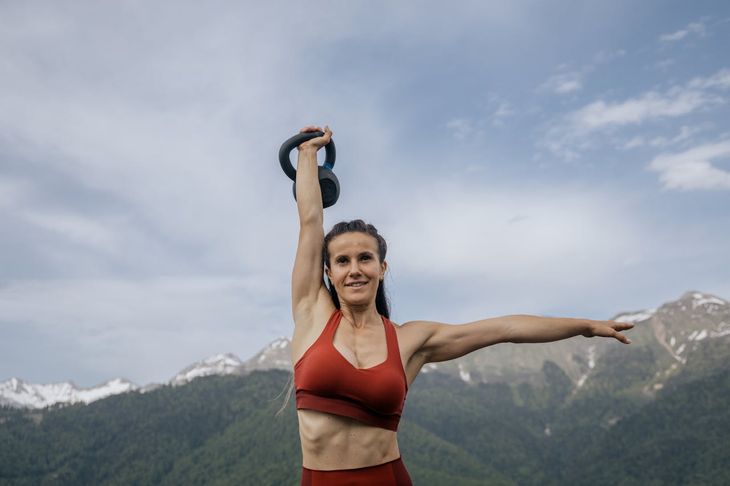 A woman with a kettlebell