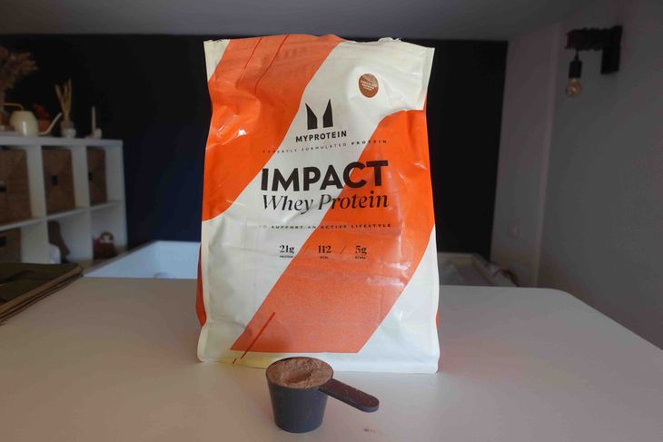 A bag and scoop of whey protein