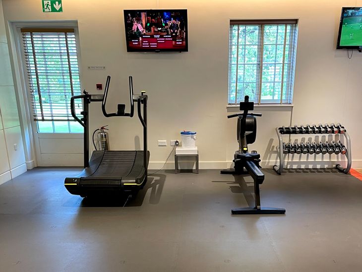 Treadmill on gym flooring for a home gym. 