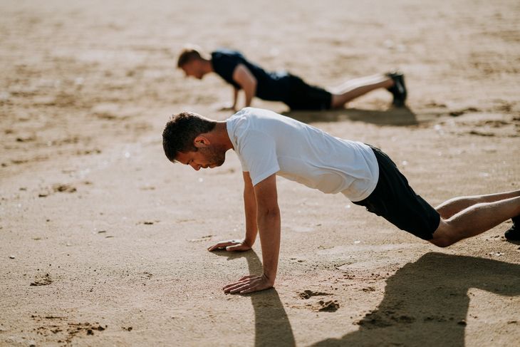 Man doing burpees as part of a weight loss circuit workout.