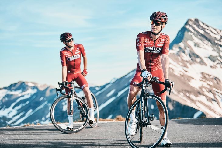 Two cycling personal trainers in the mountains.