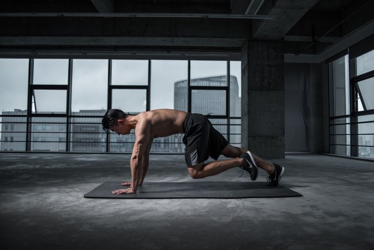 Man doing mountain climbers as part of a weight loss circuit workout.