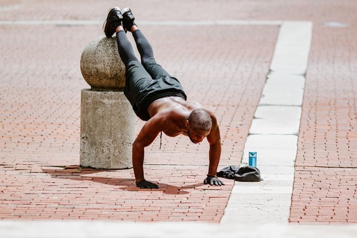 Man doing incline push ups as part of a weight loss circuit workout.