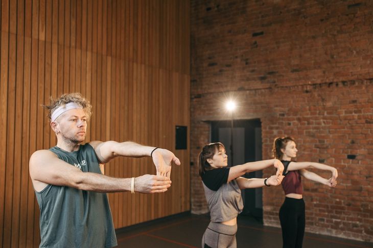 People stretching as part of small group personal training.