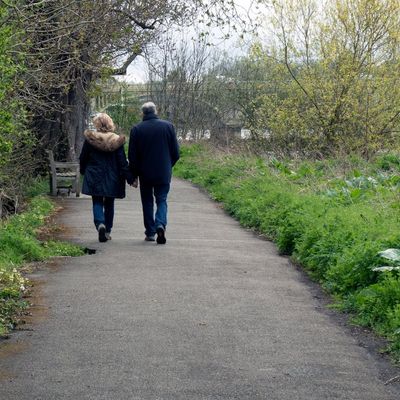 A couple working near the River Brent, near Brentford End