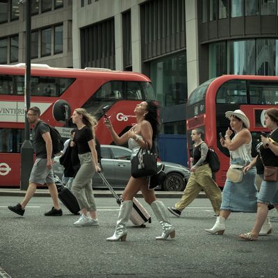 People crossing a street near Brunswick Park