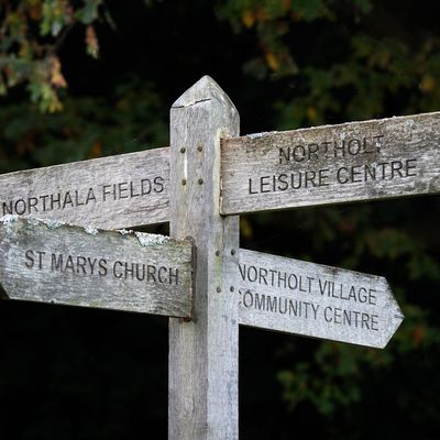 A wooden signpost in West London