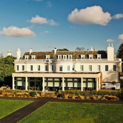 Lawns and an old white building in Wimbledon